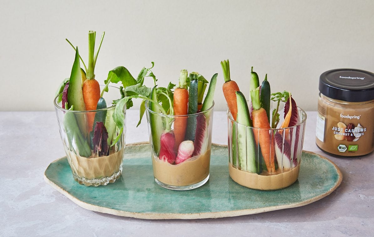 three glasses with nut butter & ginger dip and fresh vegetables